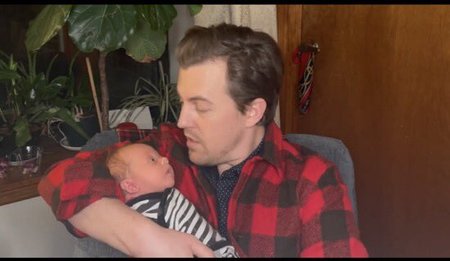 Alex Moffat with his adorable baby