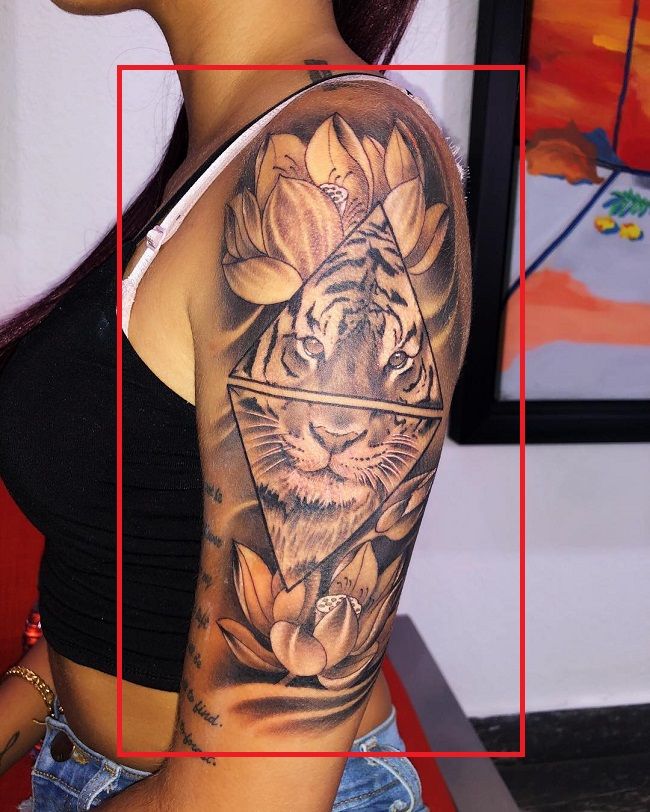 'Tiger with Lotus' tattoo on his left arm.