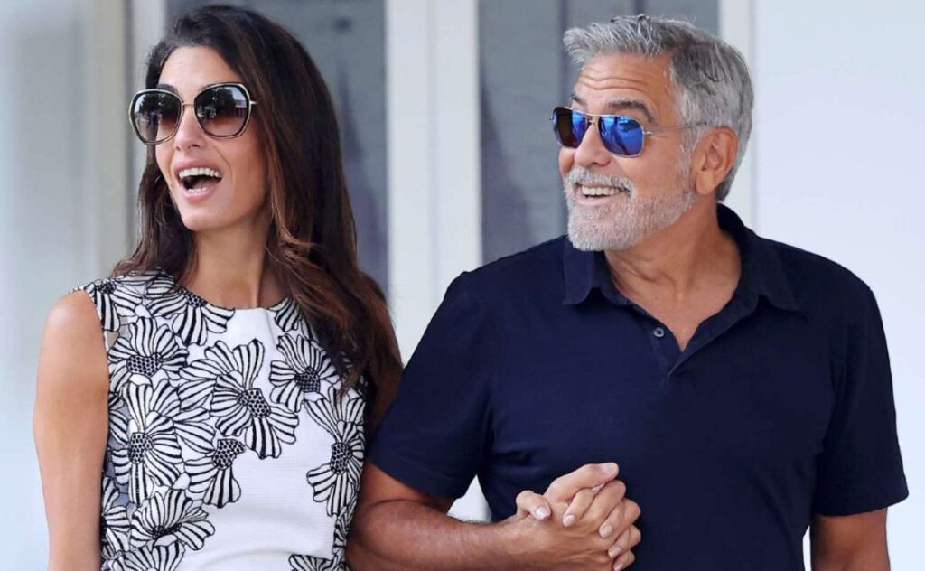 Amal and George Clooney Coordinate Their Looks in Blue and White for Venice Arrival