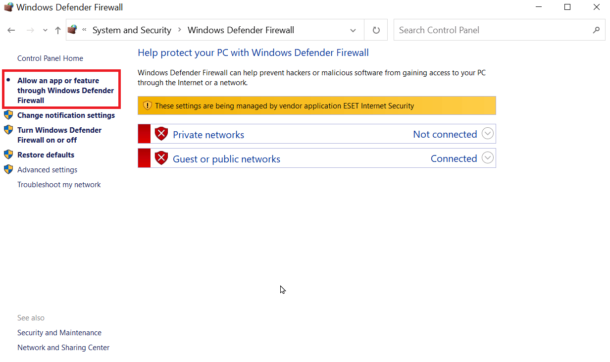 haga clic en permitir una aplicación o función a través del firewall de Windows Defender